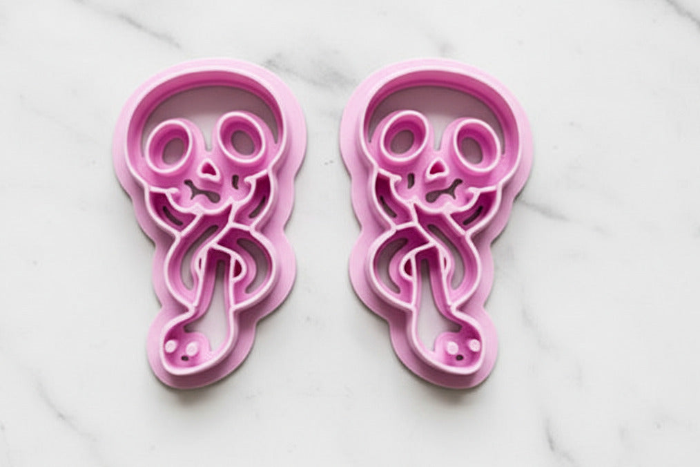 skulls with snakes mirrored