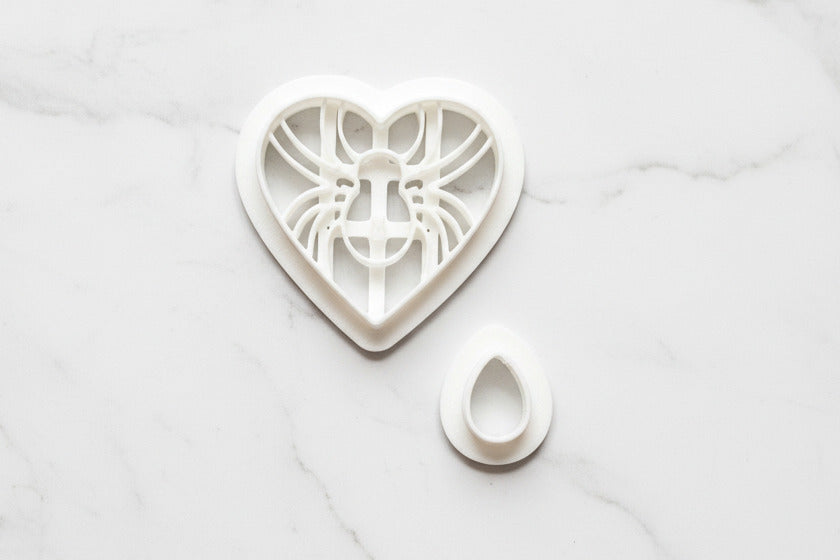 Spider in heart with a teardrop