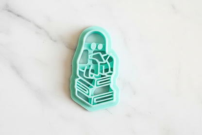 Ghost sitting on books