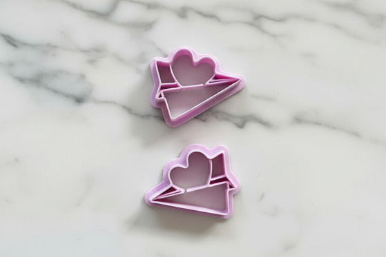 paper air plane with heart