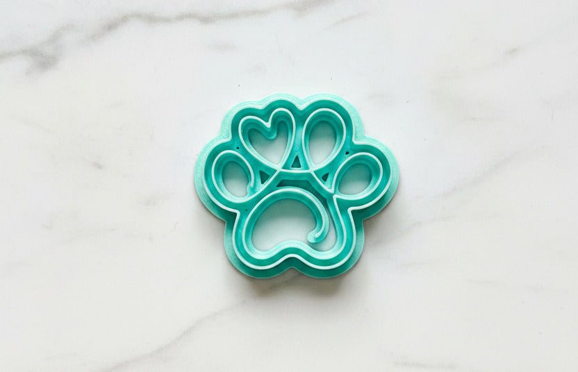 Lined paw print with heart